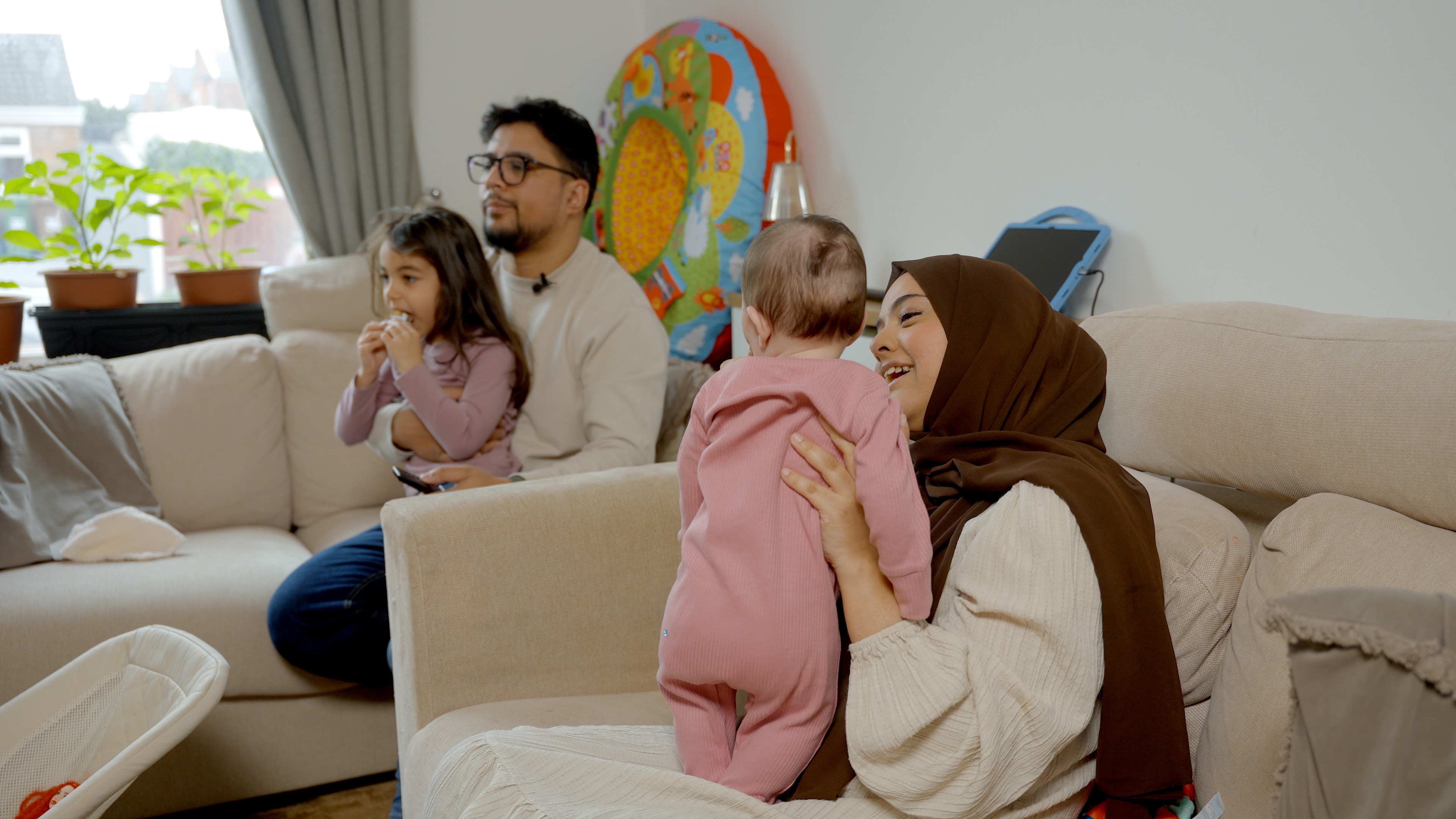 Family group watching TV together